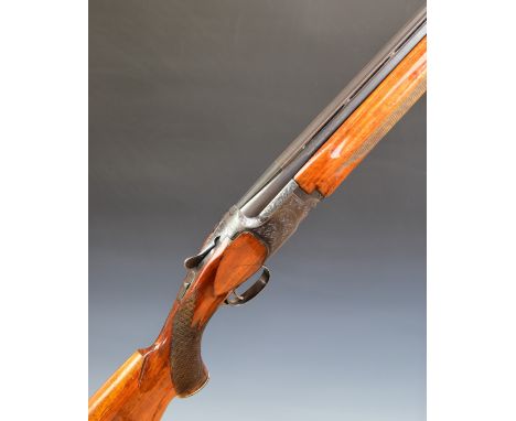 Miroku 12 bore over and under ejector shotgun with engraved locks, underside, trigger guard, top plate and thumb lever, chequ