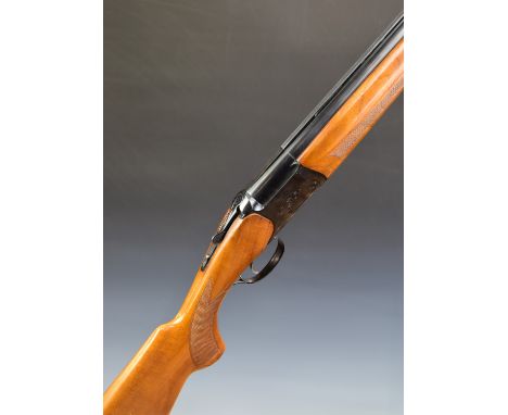 Baikal 12 bore over and under ejector shotgun with engraved lock and trigger guard, single trigger, chequered semi-pistol gri