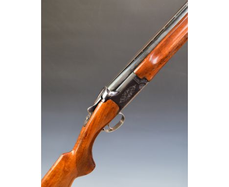 Miroku 12 bore over and under ejector shotgun&nbsp;with engraved locks and underside, chequered semi-pistol grip and forend, 