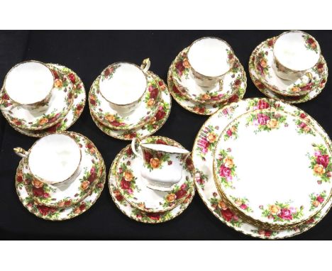 Twenty four pieces of Royal Albert Old Country Roses comprising six trios, six plates and a larger calandar plate, largest D: