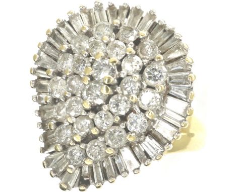 18ct gold baguette and round cut diamond set ring, size O, 9.7g. P&amp;P Group 1 (£14+VAT for the first lot and £1+VAT for su