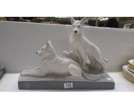 A French ceramic figure group of two dogs.