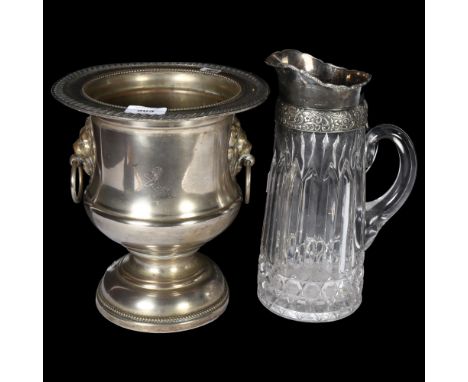 A silver plated Champagne bucket, with lion mask ring handles, H25cm, and a moulded glass and silver plated mounted water jug