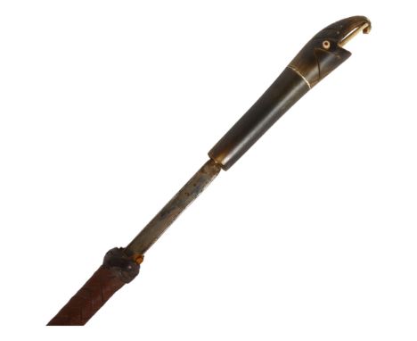 An early 20th century swagger sword stick, a 32.5cm plain blade with no maker's marks, with a carved horn elephant design han