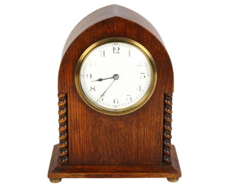 An Edwardian oak lancet-top mantel clock, with French movement and enamel dial, H20cmGood overall condition, general surface 