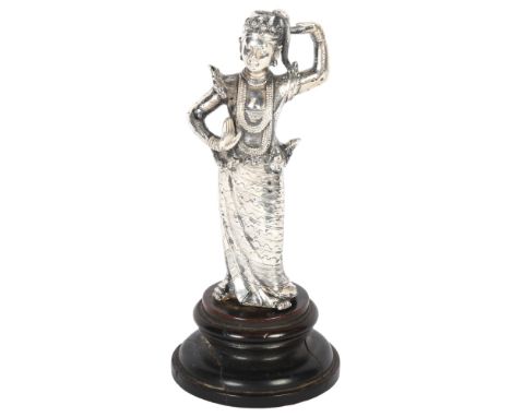 A late 19th century? Burmese white metal figure, study of a deity on turned wood plinth, H17cmFigure is in good overall condi