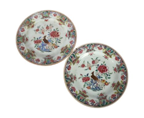 A pair of famille rose Chinese plates, diameter 23cm1 has a hairline crack running from the top edge in, 1 has a visibly repa