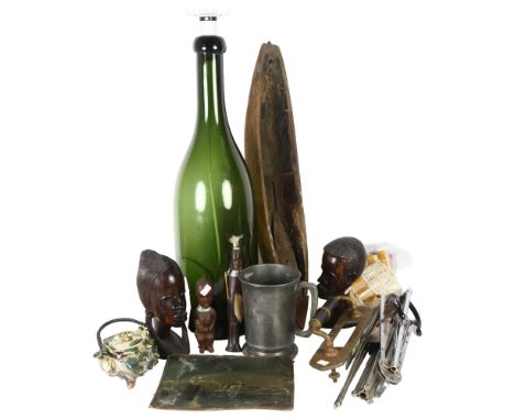 A dug-out model canoe, L62cm, a large Antique green glass bottle converted to an electric lamp, various modern Tribal art, a 