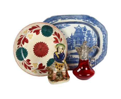 A 19th century Willow pattern meat dish, 53cm, a painted dish, ruby glass Claret jug with embossed plated mount, and a Staffo