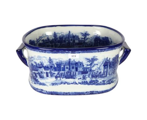 A reproduction ceramic 2-handled foot bath with blue and white printed decoration, overall length 46cm 