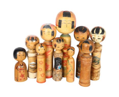 A group of 10 Vintage Japanese Kokeshi wooden dolls, with painted decoration, tallest 37cm 