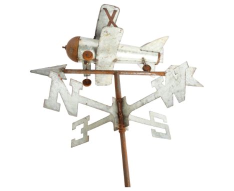 A wrought-iron and pressed metal weather vane, surmounted by a bi-plane, overall height 115cm 