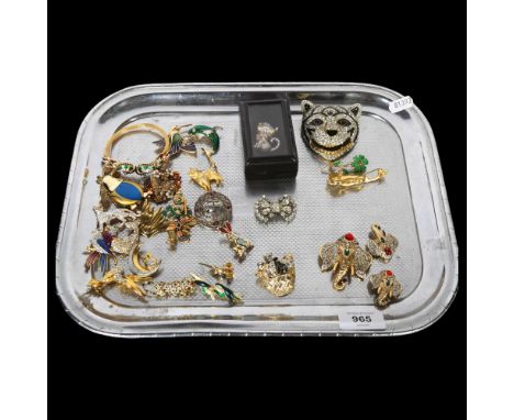 A collection of ornate gilt-metal and stone set brooches, mainly in animal form, including elephants, cats, bird, peacock des