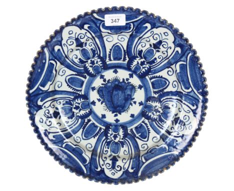 A large blue and white Continental tin-glazed ceramic charger, diameter 34cm 