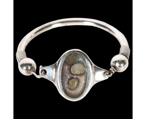 A Scandinavian stone torque bangle, unmarked silver settings, panel length 31.9mm 