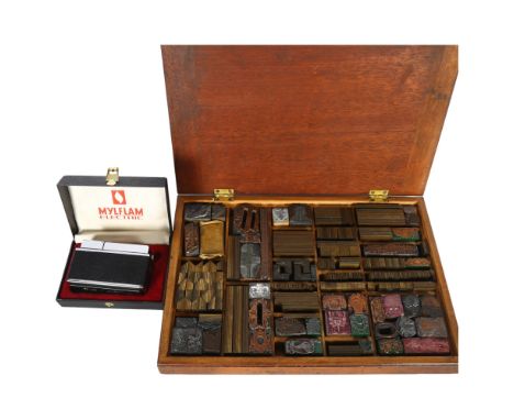 A mahogany-cased collection of Vintage printing blocks, box length 33.5cm, and a Mylflam electric cigarette lighter 