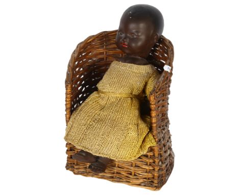 A Vintage Armand Marseilles German doll, no. 351/2K, 33cm, and a wicker chair 