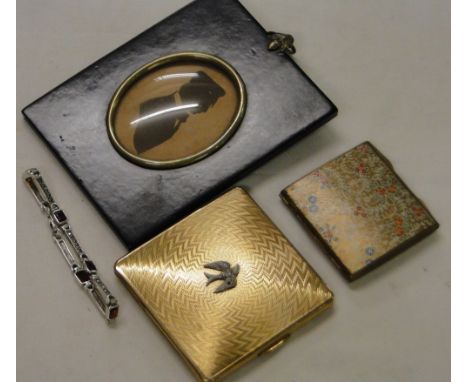 A sterling silver bracelet, a Kigu compact, silhouette, etc.