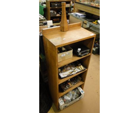 A 1930s light oak open bookcase with carved lizard to the pediment, (by Martin Lizardman Dutton).