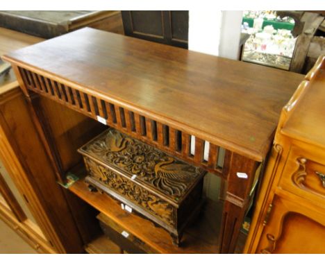 A mahogany rectangular console table with fluted legs.
