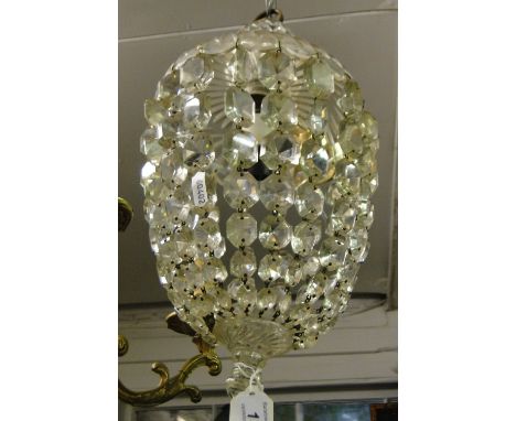 Circular glass light fitting with lustre drops.