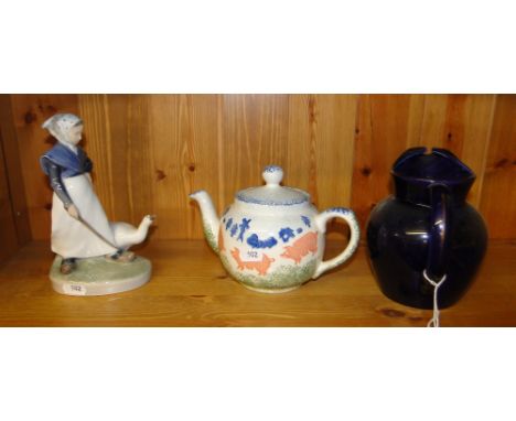 A Royal Copenhagen goose girl, a teapot and a jug.