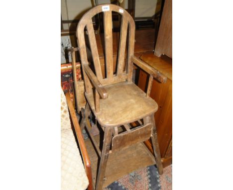 A Vintage stained wood folding high chair.