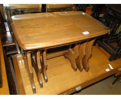 A nest of 3 Ercol elm rectangular coffee tables.