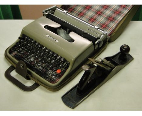 A Record plane and a portable typewriter in case.
