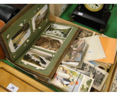 An album and loose postcards including Louis Wain and Mabel Lucie Attwell.