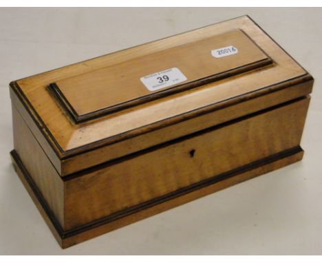 A mahogany tea caddy with inner lids.