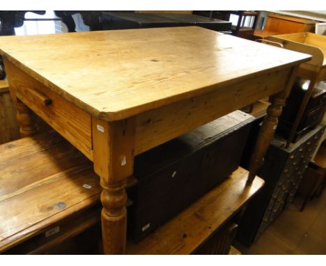 A Vintage pine kitchen table with end frieze drawer on turned legs, length 3'9".