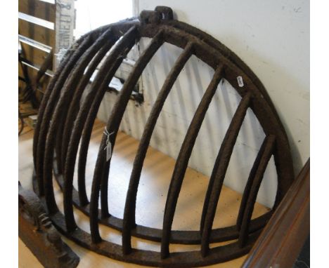 Pair of Vintage cast-iron hay racks.