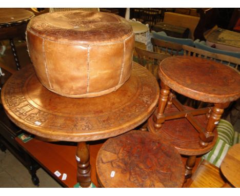 A Peruvian embossed leather circular coffee table on turned wood base, together with 3 similar circular stools and pouffe