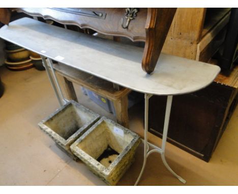 A galvanised and painted metal console table, on shaped base.