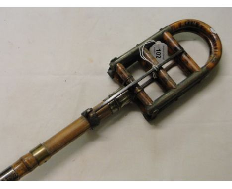 A Vintage shooting stick with silver collar inscribed "E C C".