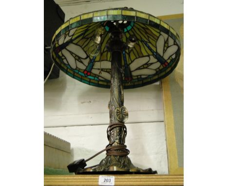 A Tiffany style table lamp with lead light dragonfly decoration to shade.