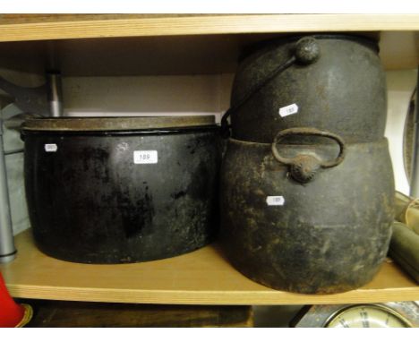 An enamel pan and cover and 2 iron cooking pots.