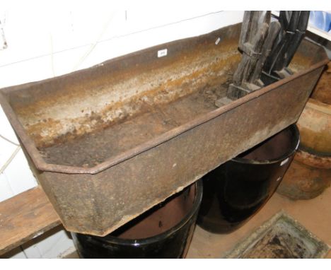 A Victorian cast-iron trough.