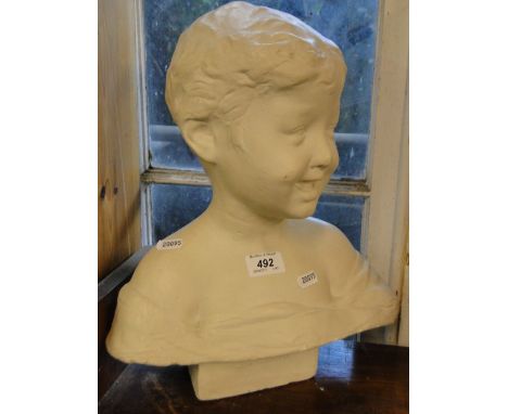 A plaster bust of a boy - J M Sharp.