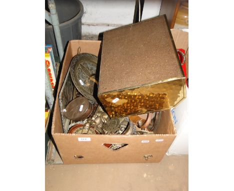 Horse brasses, copper jugs, magazine rack and a standard lamp.