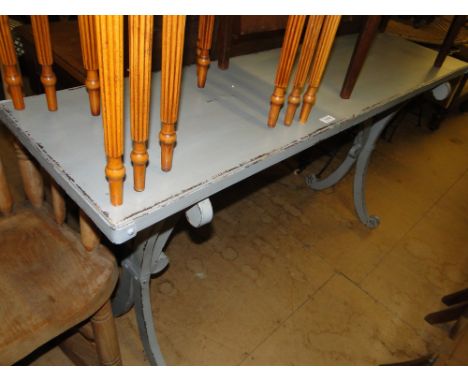 A steel console table with original distressed paint finish.
