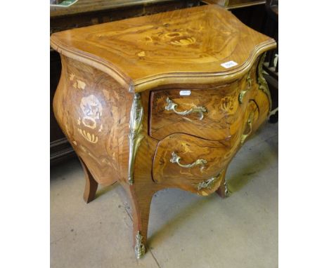 A French serpentine front walnut and Kingwood 2-drawer commode with ormolu mounts.