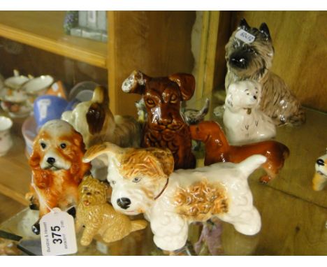 9 Dog figures including Sylvac and Royal Albert.