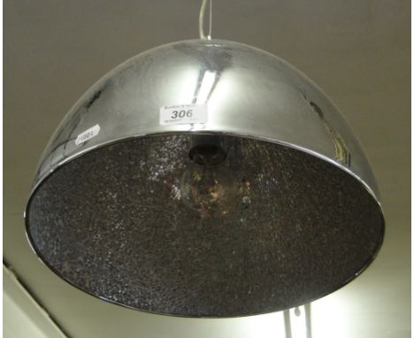 A polished steel hanging lamp.