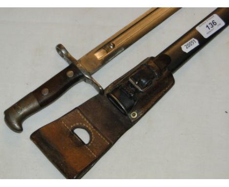 A German bayonet in steel scabbard.