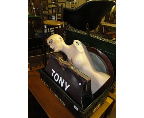 A metal trunk, leather briefcase, half mannequin, cake stand, mirror, etc.