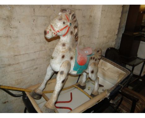 A Vintage child's painted metal rocking horse.