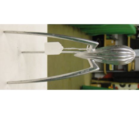 An Alessi Italian Juicy Salif lemon squeezer.