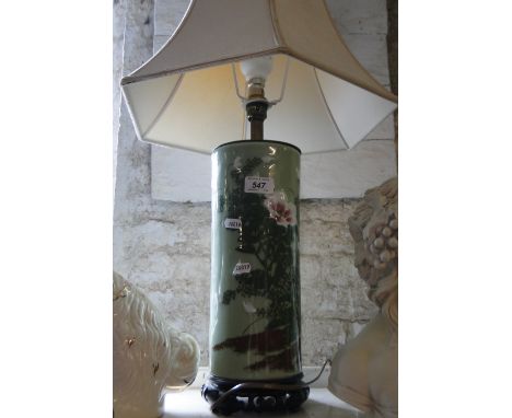 An Oriental table lamp and shade.